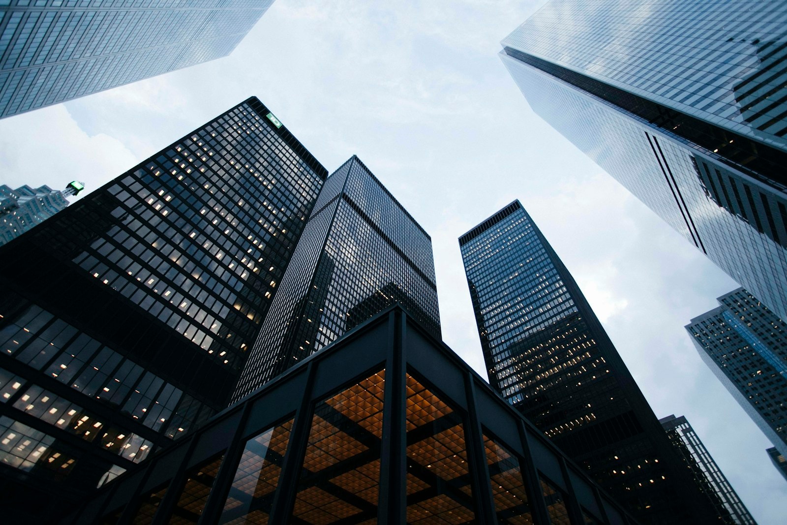 Modern glass skyscrapers reflecting the sky