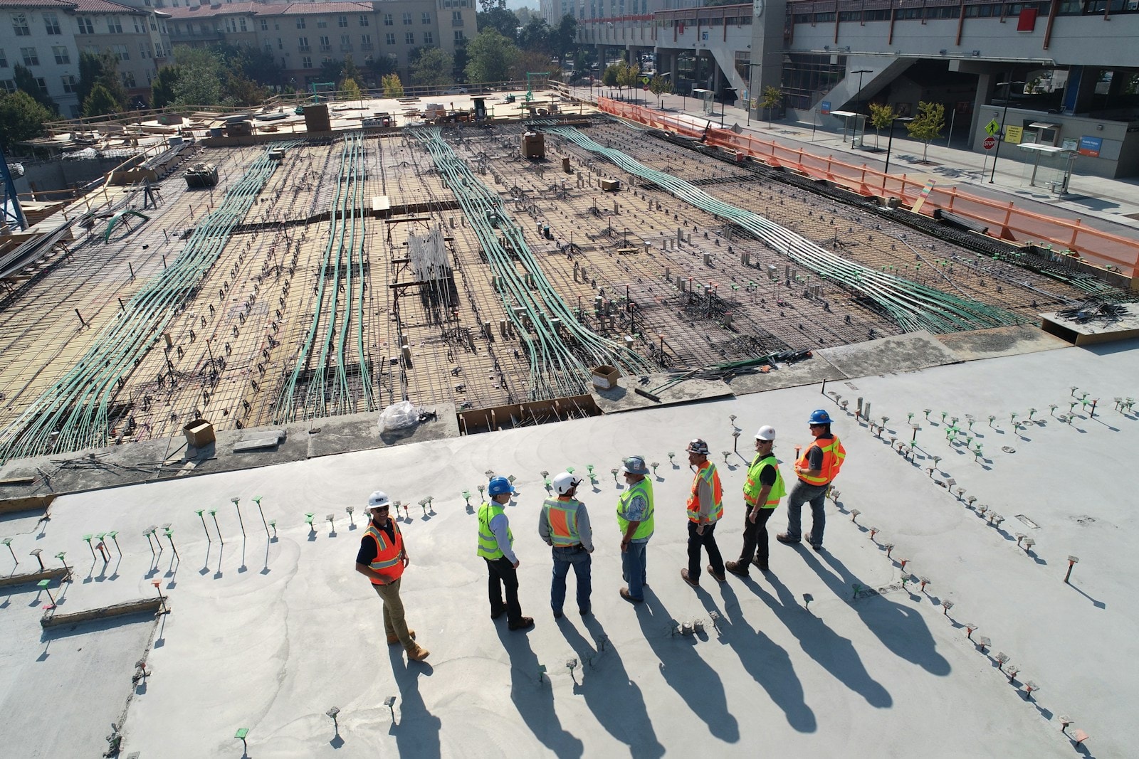 Architects reviewing building plans on site